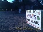 Daylight: Tune To: sign and display with FCG house in background