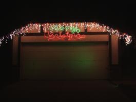 Icicle Lights and Merry Christmas over garage
